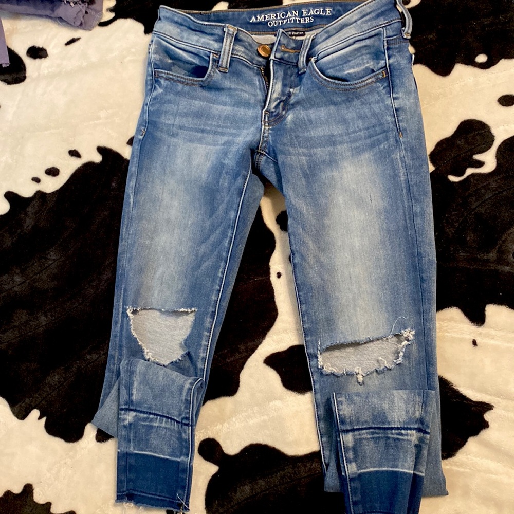 american eagle outfitters super stretch low ripped jeans. size US 2.